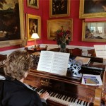 Playing an orignal antique piano at a national Trust property.jpg