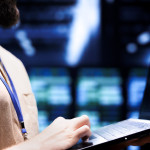 close-up-shot-technician-inspecting-crypto-mining-server-rigs-solving-complex-mathematical-equations-specialist-using-laptop-data-center-housing-blockchain-technology-high-volume-transactions-min.jpg