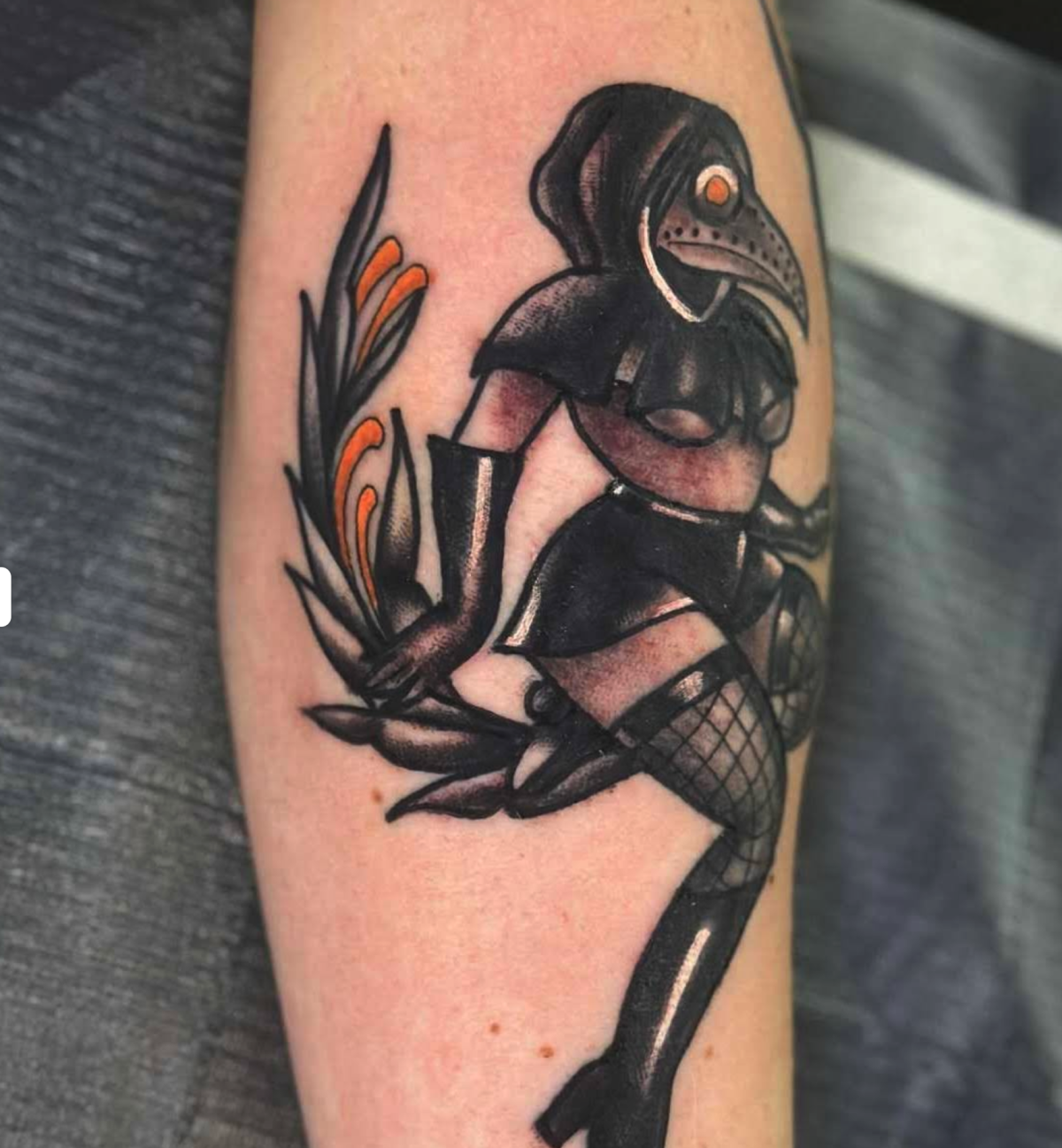 Neo-traditional plague doctor forearm tattoo
