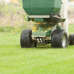 Spreader Applying Fertilizer and Weed Control.jpg