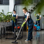 661769d56a03f2846c26699e_young-cleaner-vacuuming-floor-in-office-near-colle-2023-11-27-04-51-45-utc-p-800.jpg