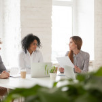 multiracial-male-female-colleagues-having-discussion-team-meeting-min-min.jpg