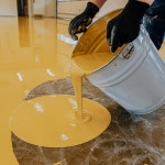 a-construction-worker-apply-epoxy-resin-in-an-indu-2023-11-27-05-14-27-utc-1024x683.jpg