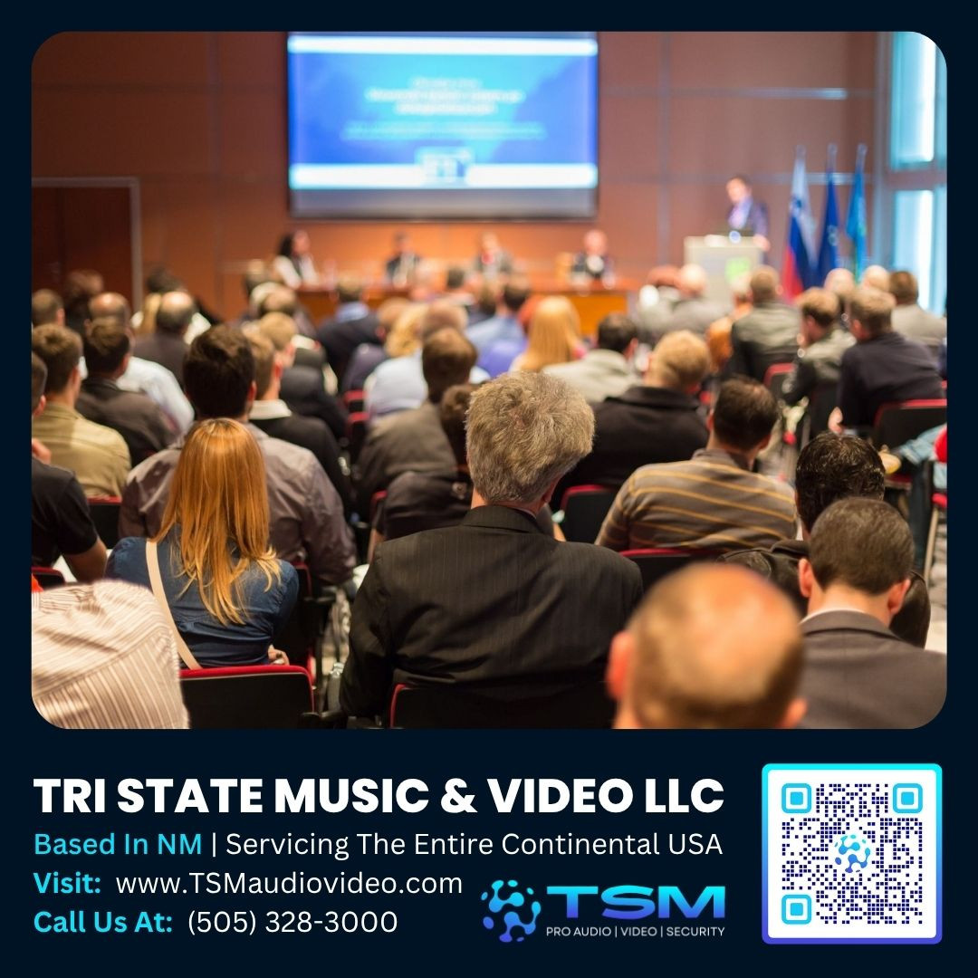 Audience attending a professional conference presentation