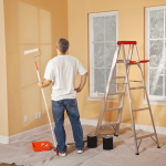 man-painting-yellow-walls.png