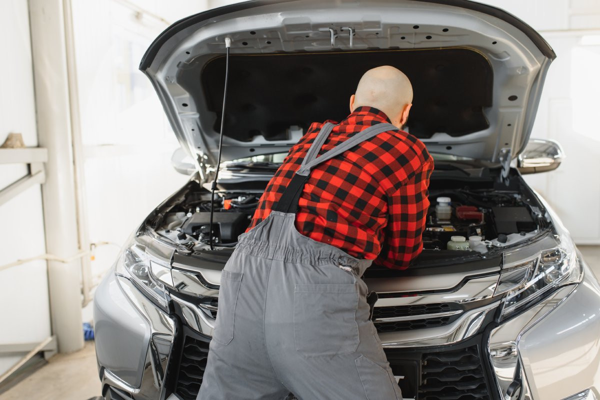 mechanic working on Asian vehicle