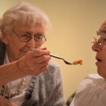 dr-haider-khan-helping-elderly-man-eat.jpg