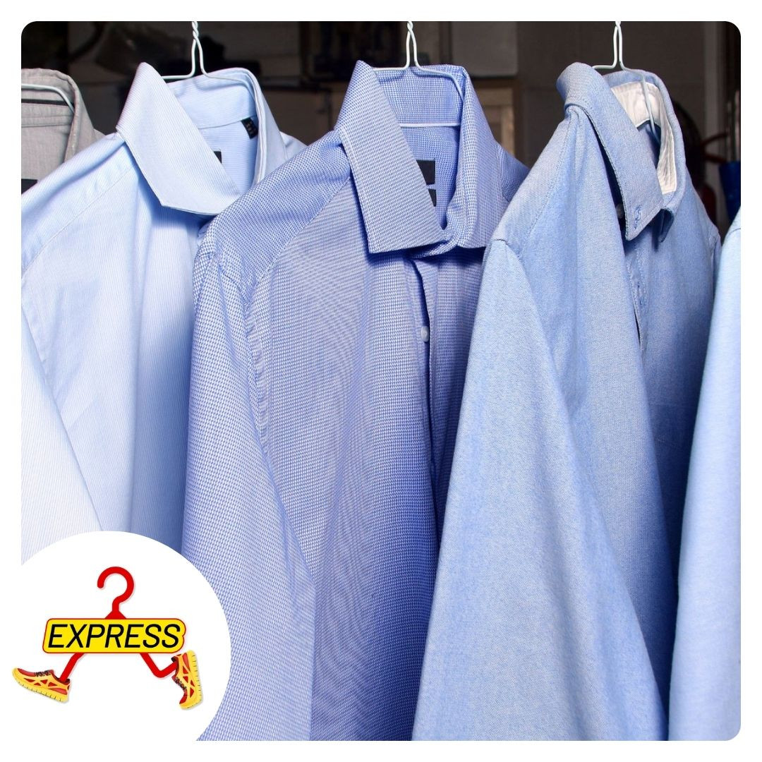 shirt dresses hanging in a dry cleaning shop