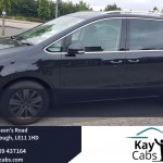 Kaycabs Minibus taxi with driver waiting for a party group.jpg