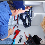 plumber inspecting under sink.png