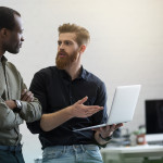 two-young-smart-business-men-discussing-new-project.jpg