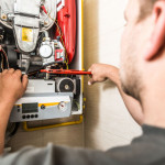 technician repairing furnace.jpg