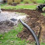What Are the Key Differences Between French and Trench Drains in Landscape Drainage and Grading Solutions for McKinney, TX Lawns.jpg