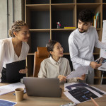 office-workers-using-finance-graphs-min.jpg