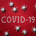 Canva - Concept Of Covid-19 In Red Background.jpg