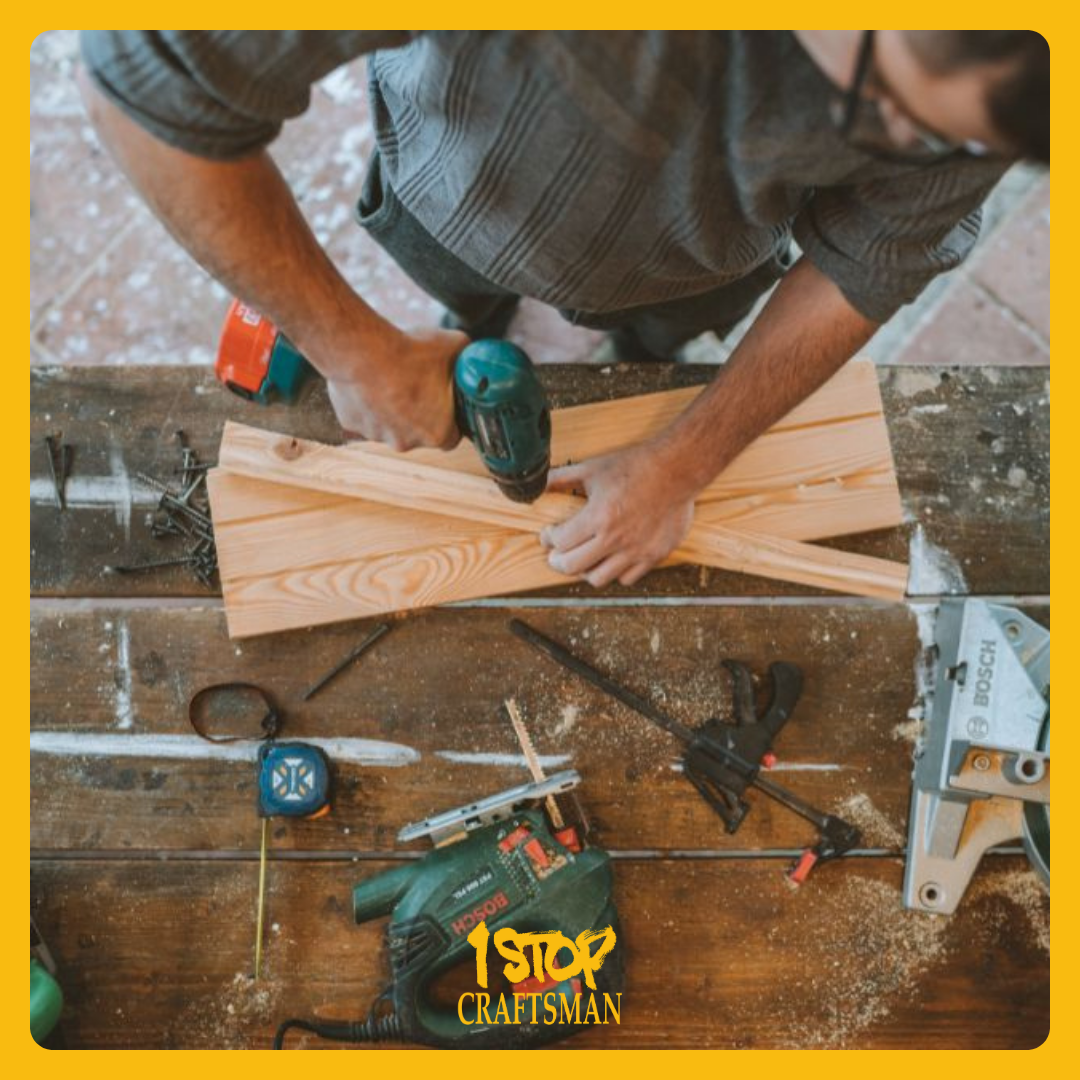 Handyman drilling wooden planks