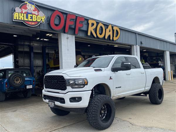 Lifted RAM 2500 with upgraded steering components on a St. Louis road
