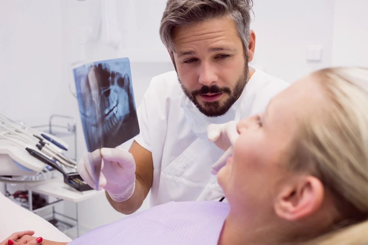 denist consulting with a patient