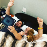 Eric Couch and his dad Vernon attending virtual Sunday worship from the hospital bed
