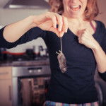 woman-holding-a-dead-rodent.jpg