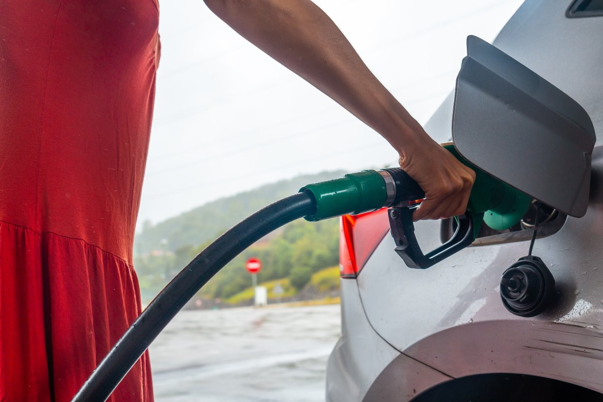 woman refueling gasoline at the gas station