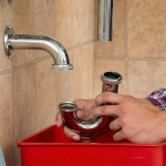 plumber installing pipe drain.jpg