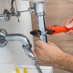 plumber fixing blocked drain.jpg
