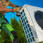 hvac maintenance technician installing large modern equipment.jpg