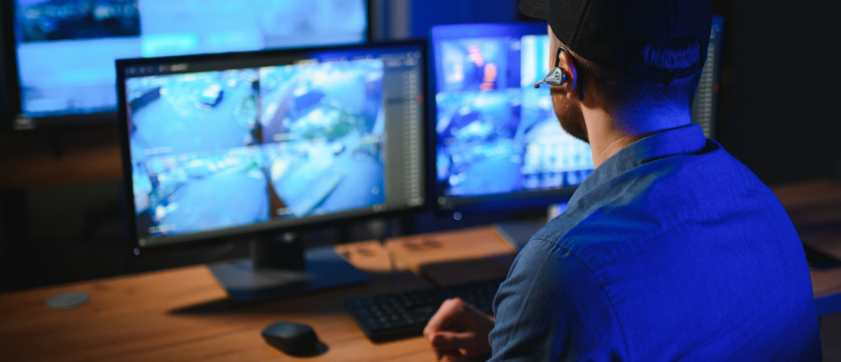 AI-enabled commercial security cameras in a Manhattan storefront, cloud-managed and mobile-accessible for real-time alert