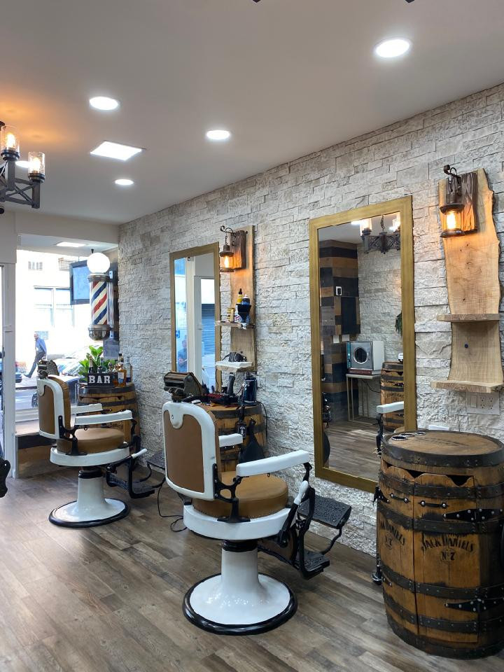 barbershop interior with vintage-style chairs, mirrors, and decor